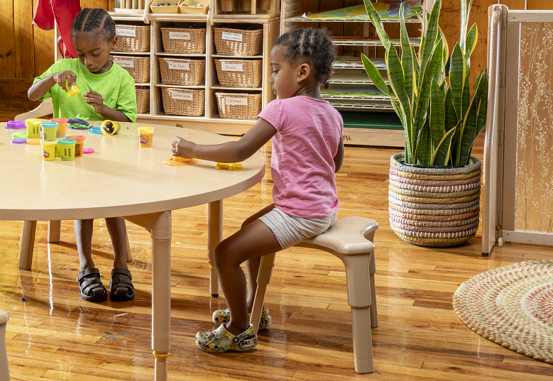 Children doing activities at a table