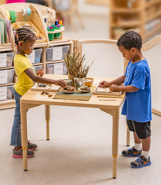 Preschool boy playing in Mud Kitchen